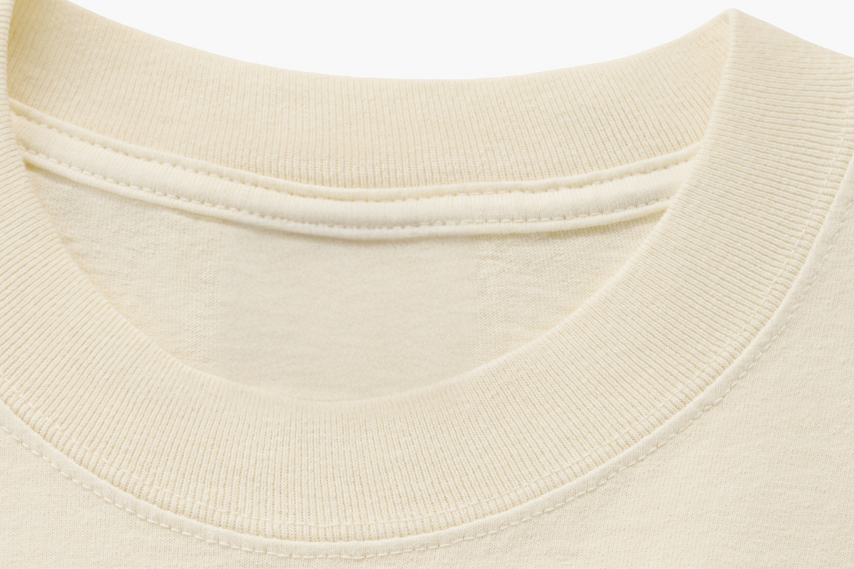Macro of the collar rib, shoulder seam and dense cotton weave