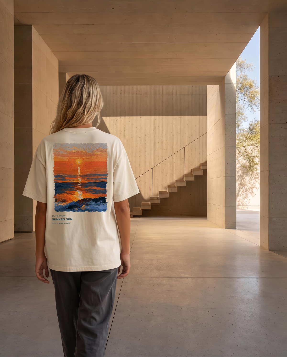 A model walking away down a concrete corridor in the Sunken Sun tee